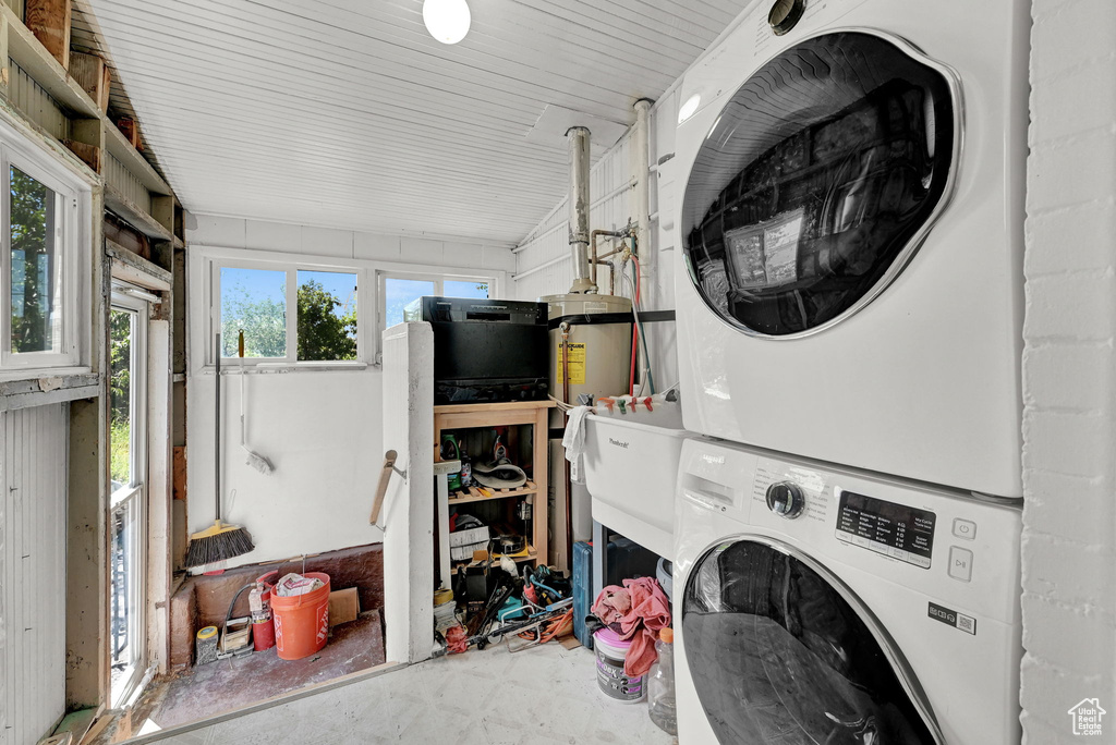 Laundry room featuring stacked washer / drying machine