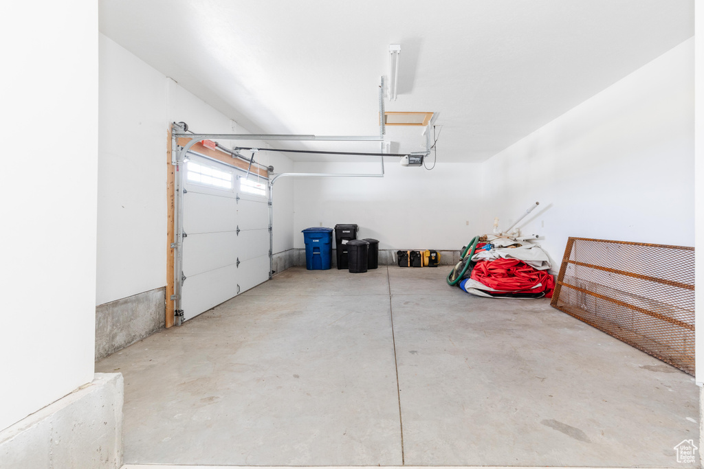 Garage featuring a garage door opener