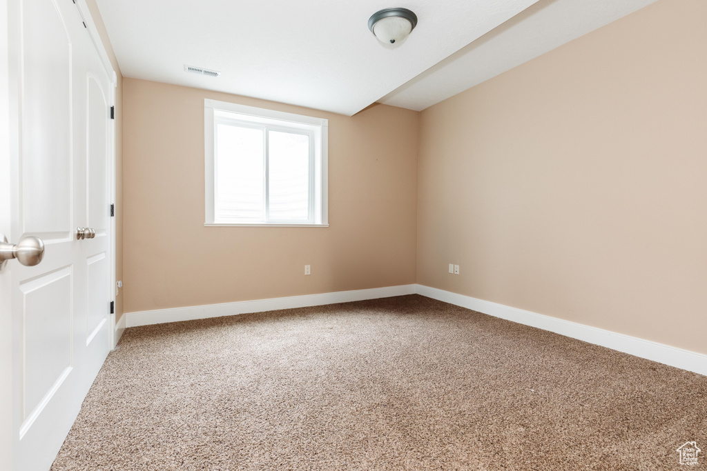 View of carpeted spare room