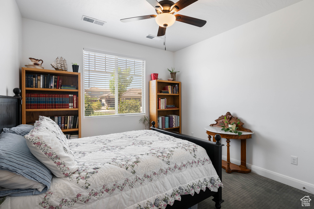 Bedroom with ceiling fan and carpet flooring