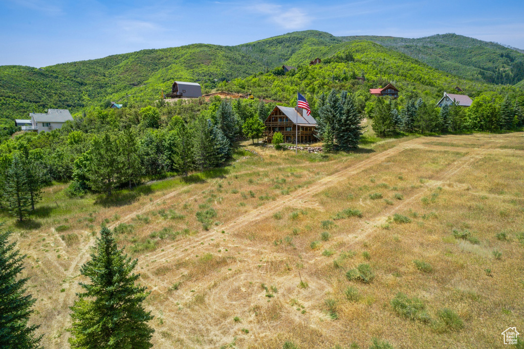 Birds eye view of property featuring a mountain view