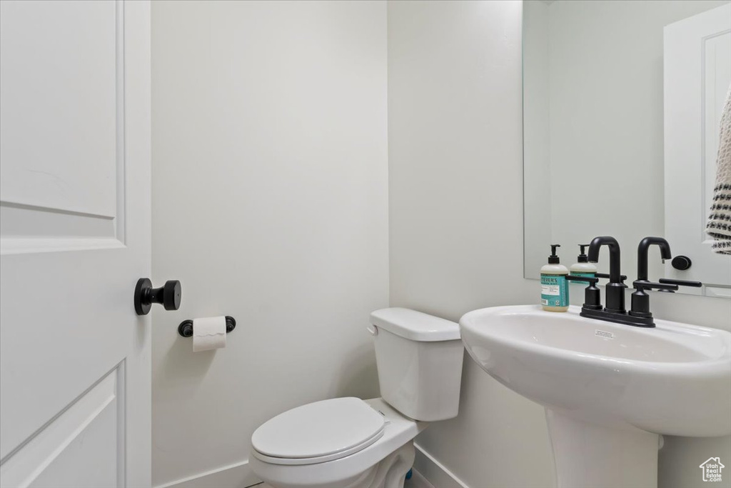 Bathroom with sink and toilet