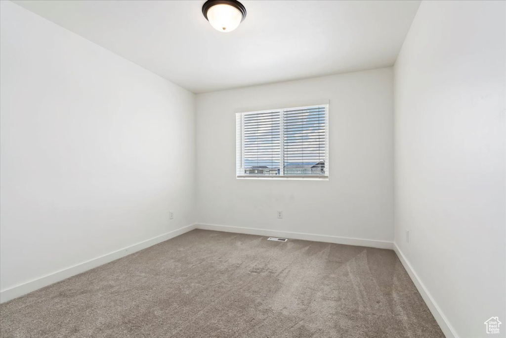 Empty room featuring carpet flooring