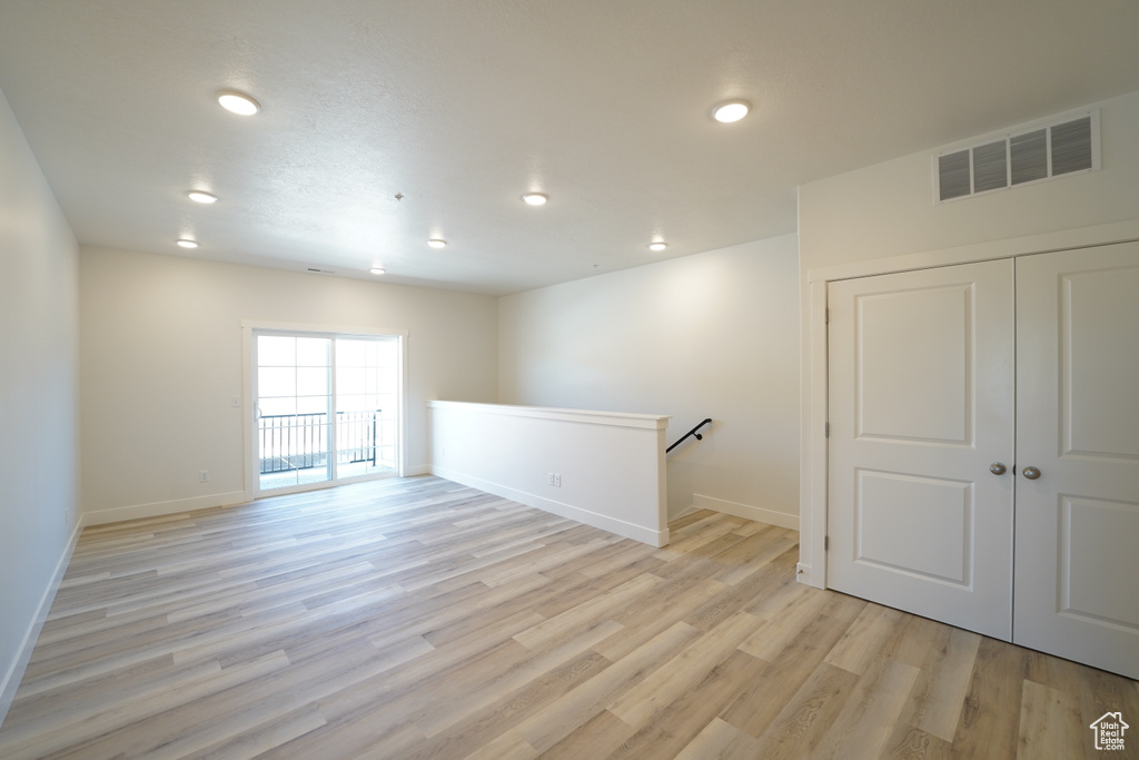 Unfurnished room featuring light wood-type flooring