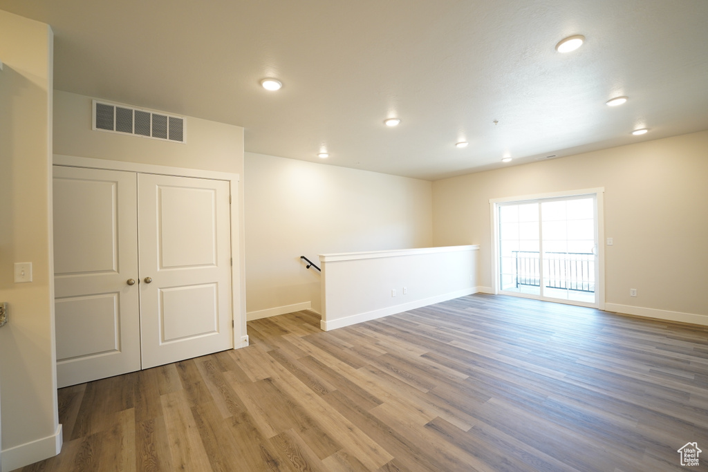 Spare room featuring hardwood / wood-style flooring