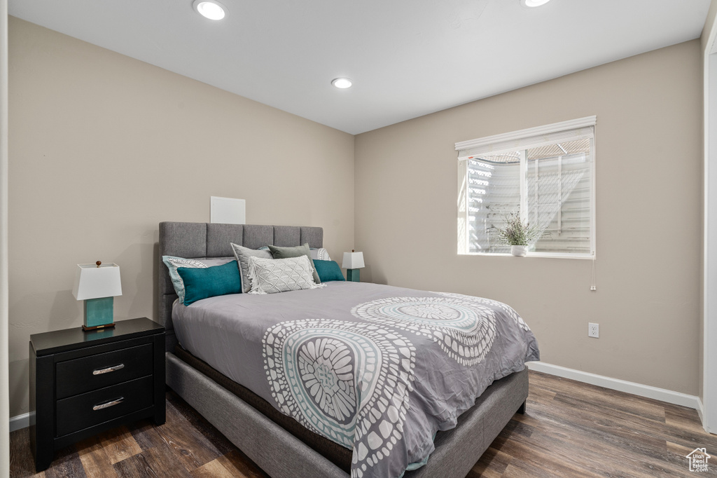 Bedroom featuring dark wood-type flooring