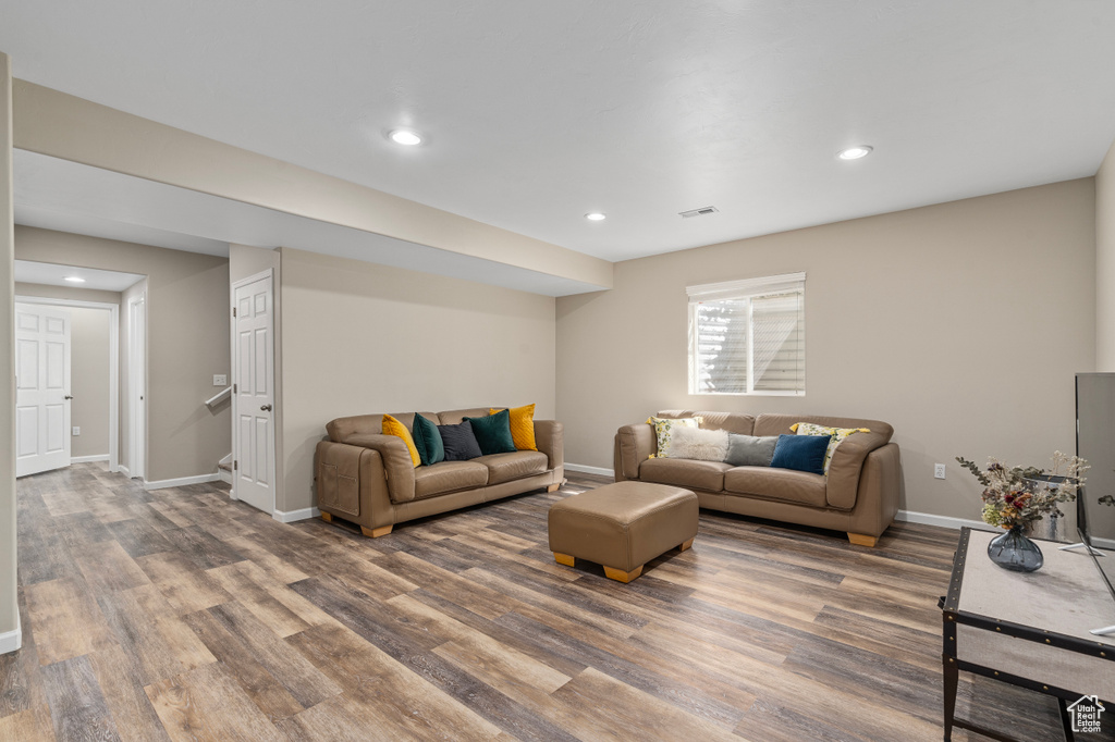 Living room with wood-type flooring