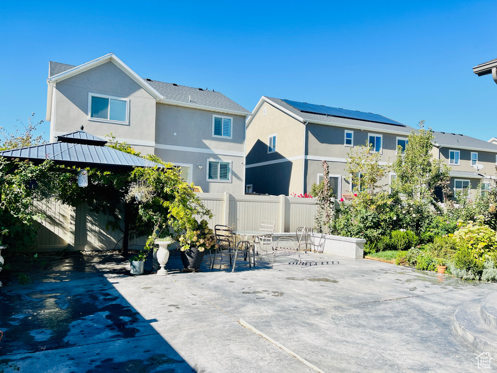 Rear view of property featuring a patio