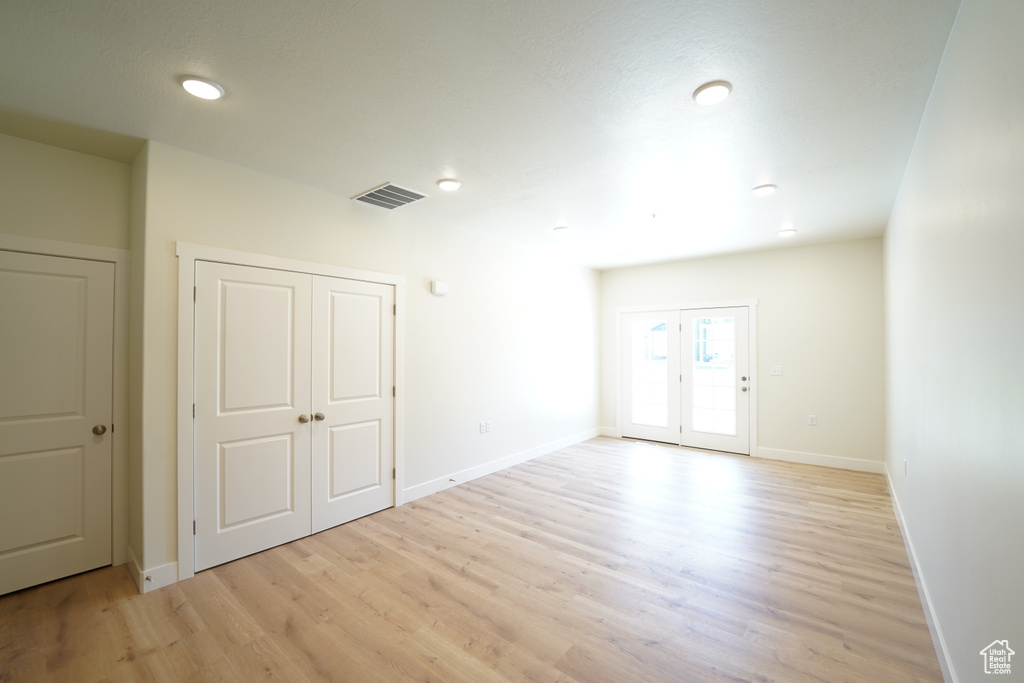 Interior space featuring light hardwood / wood-style floors and french doors