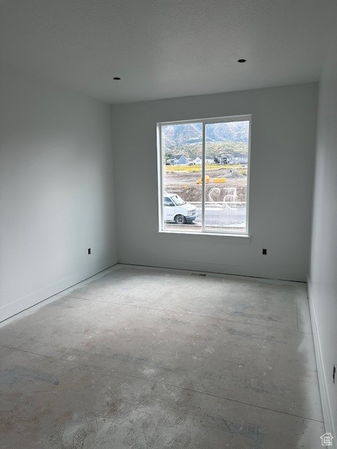 Empty room with a textured ceiling