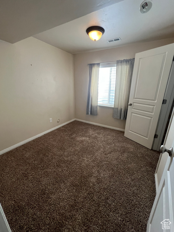 Unfurnished bedroom featuring carpet flooring