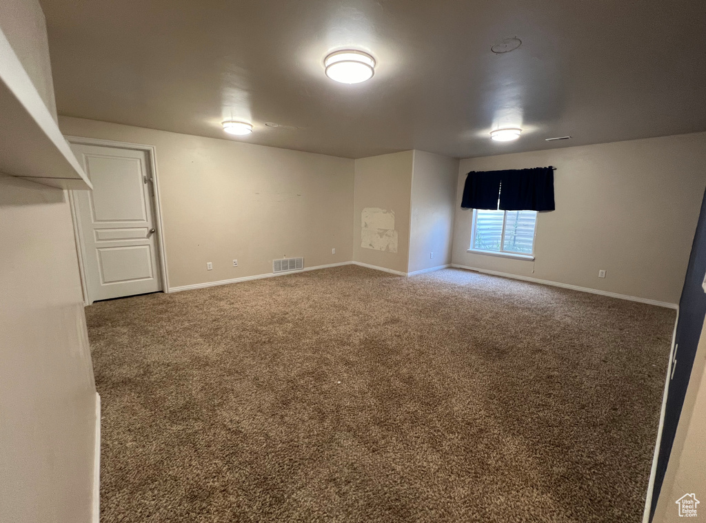 Basement featuring carpet flooring