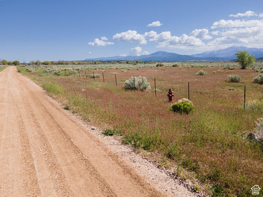 View of road with a rural view and a mountain view