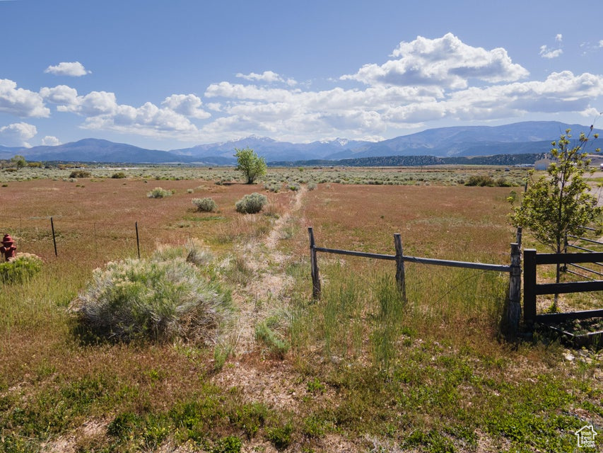 Property view of mountains with a rural view