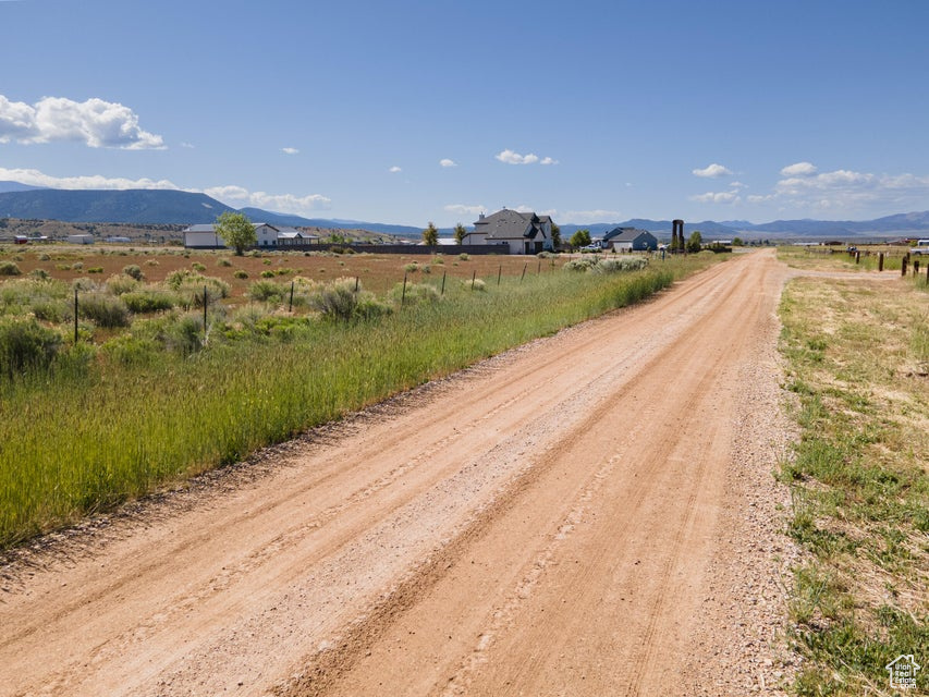 View of road featuring a rural view and a mountain view