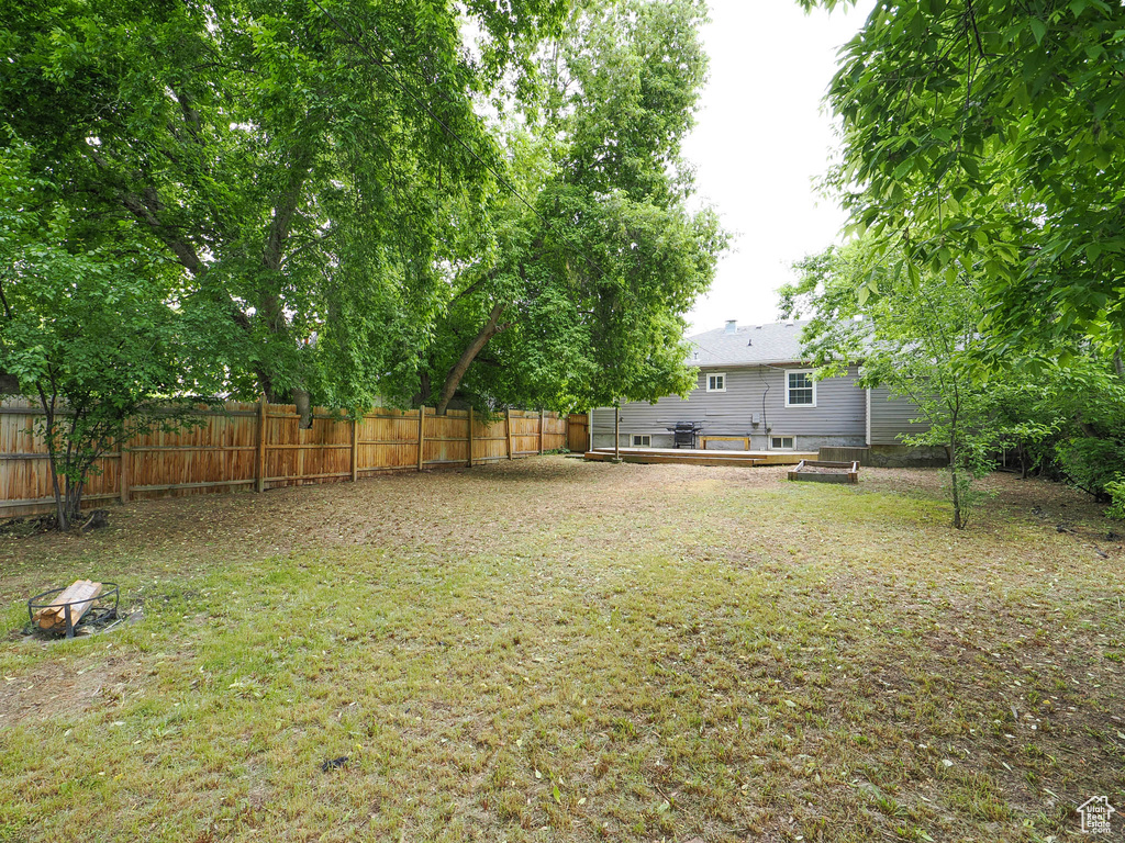 View of yard with a deck