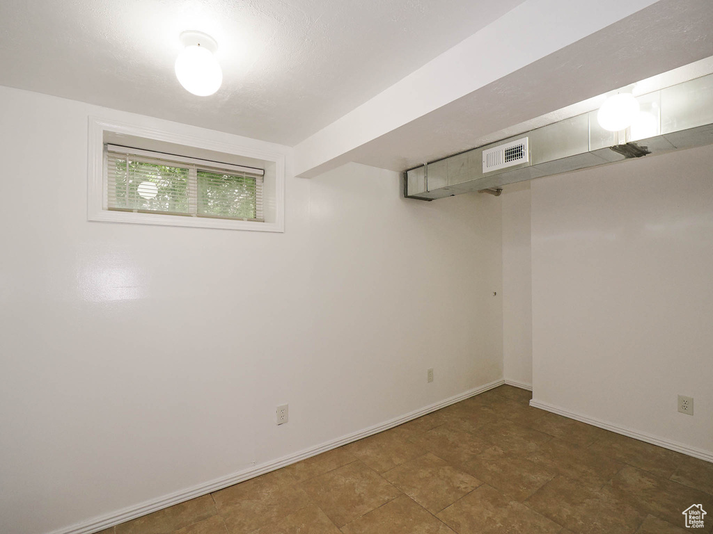 Basement with tile patterned floors