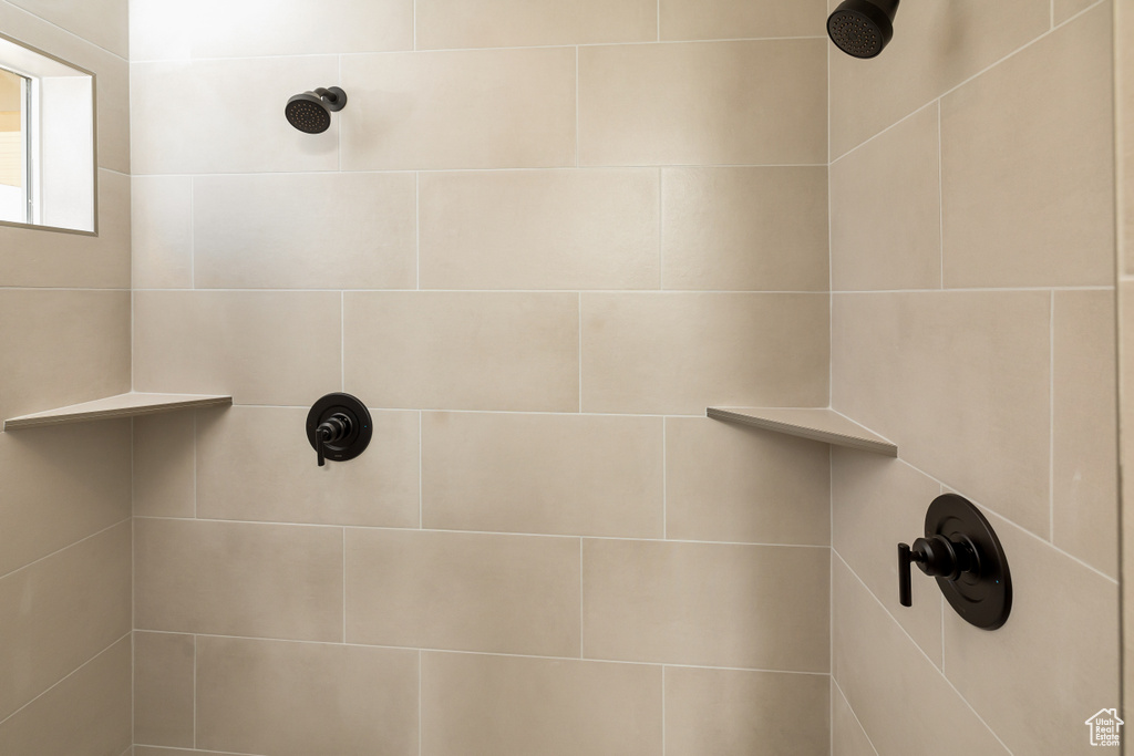 Bathroom featuring tiled shower