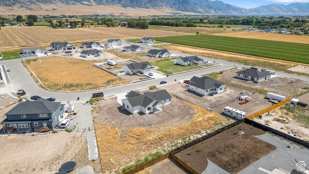 Birds eye view of property with a mountain view