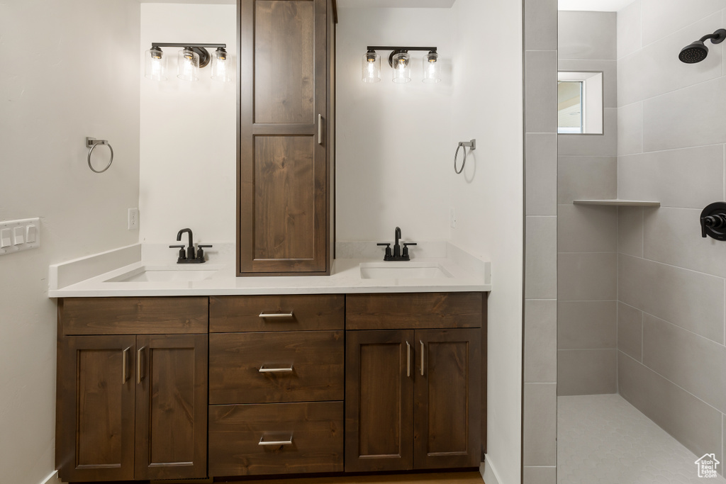 Bathroom featuring dual bowl vanity