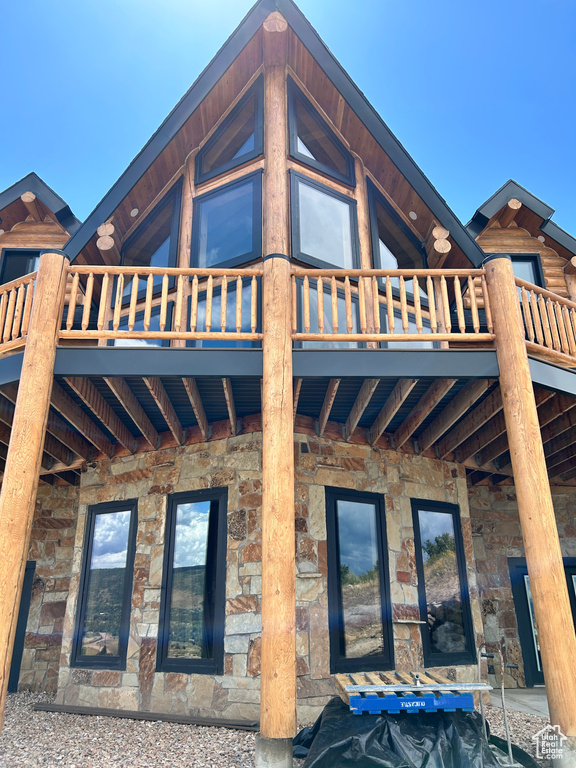 View of home's exterior featuring a balcony