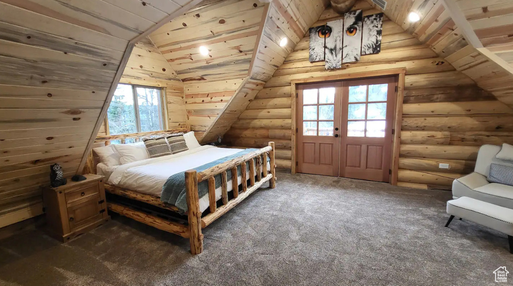 Carpeted bedroom with wooden ceiling, lofted ceiling, log walls, and multiple windows