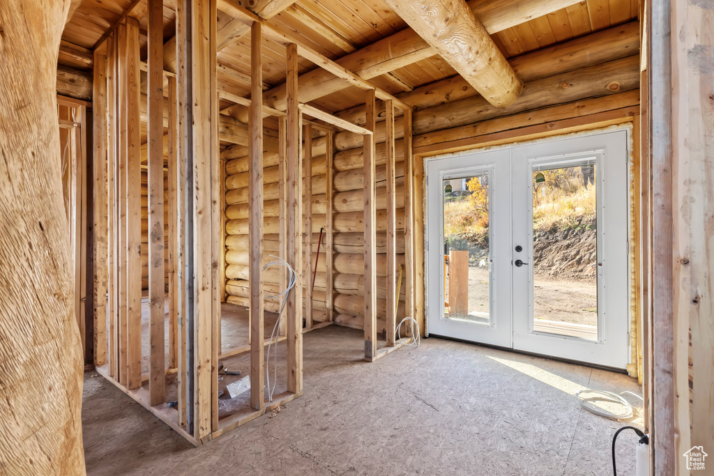 Misc room with log walls and french doors