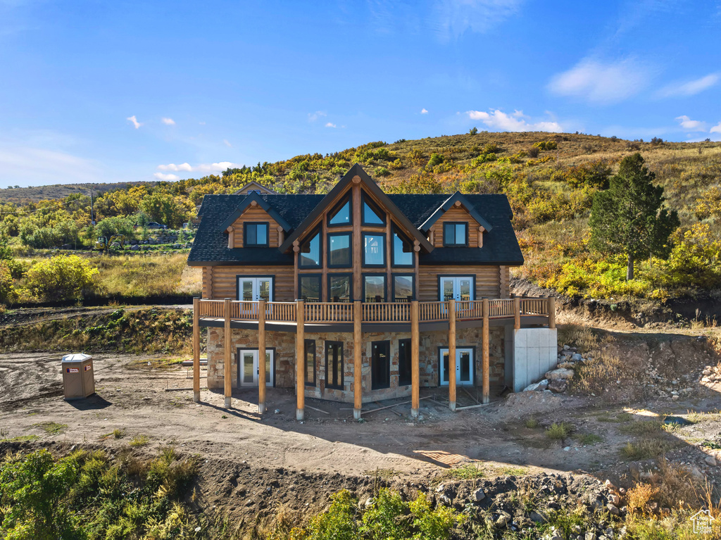 Rear view of property featuring a balcony