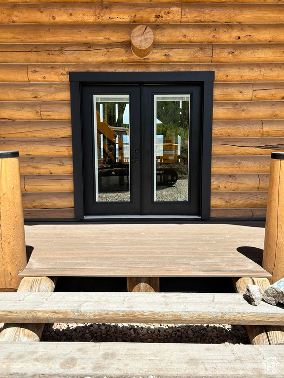 Exterior details with french doors and rustic walls