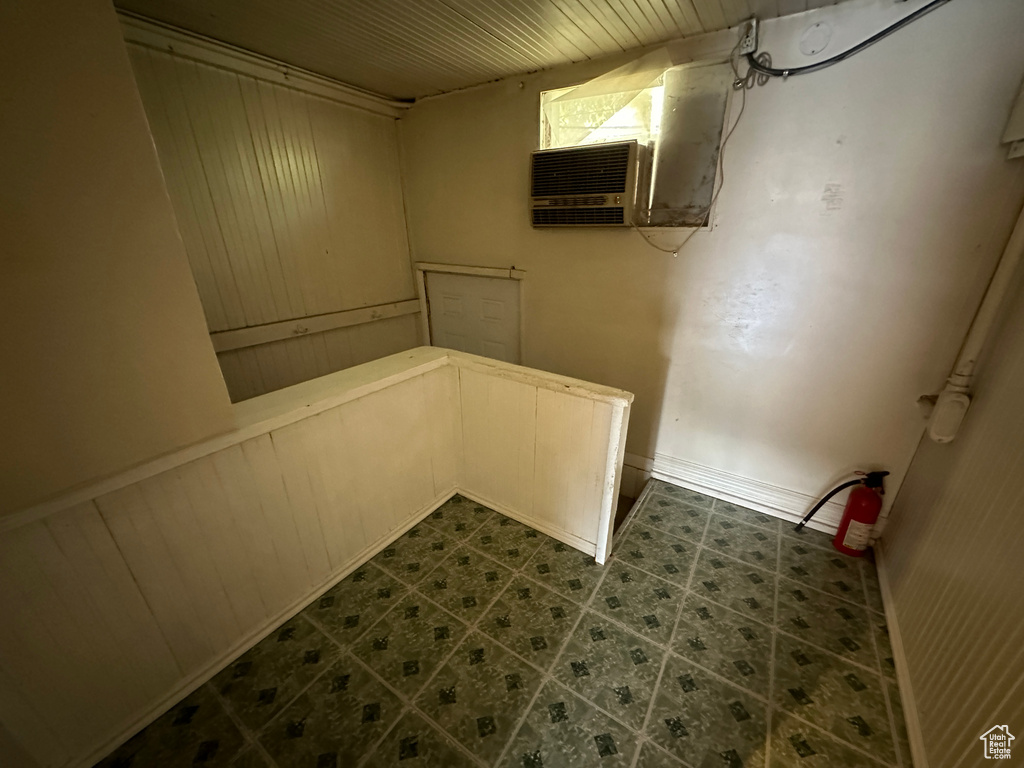 Interior space featuring dark tile patterned floors