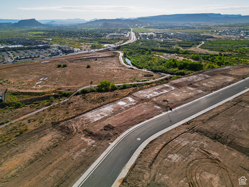 Birds eye view of property with a mountain view