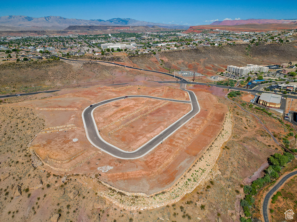 Birds eye view of property with a mountain view