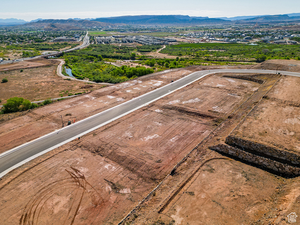 Birds eye view of property with a mountain view