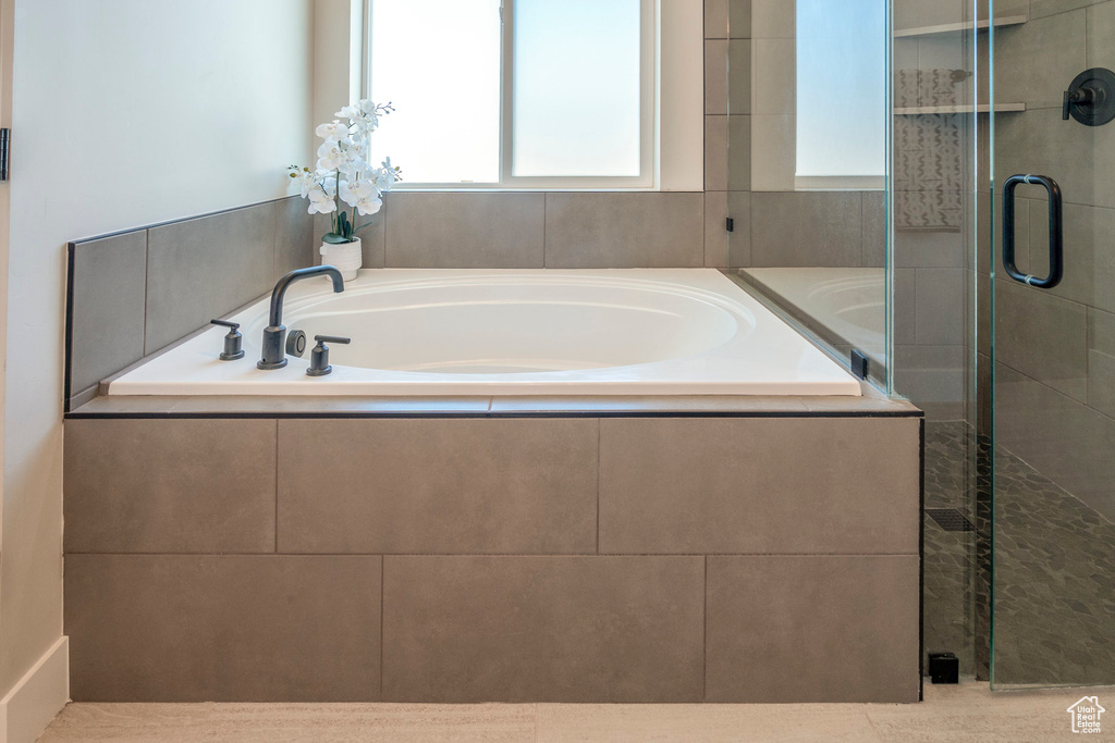 Bathroom featuring separate shower and tub