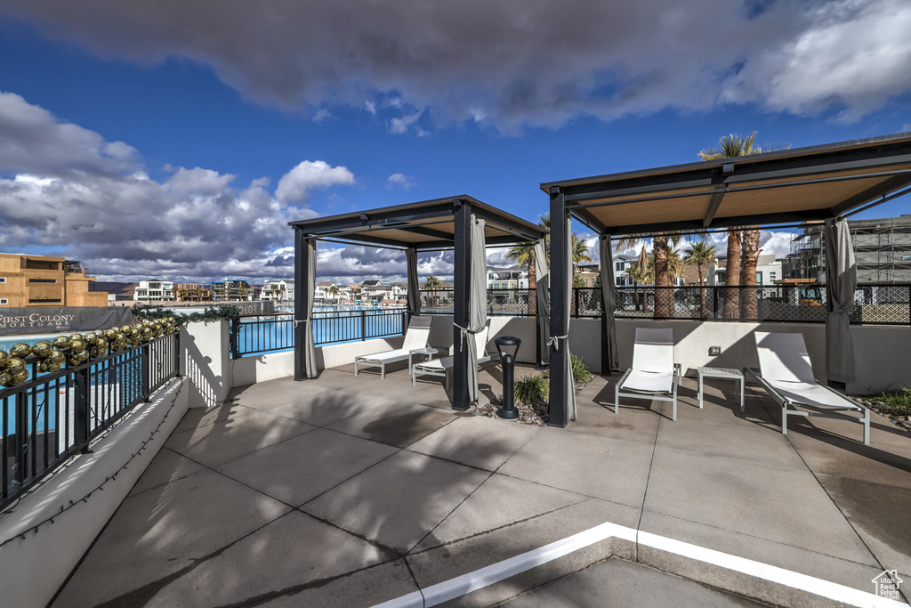 View of patio featuring a balcony