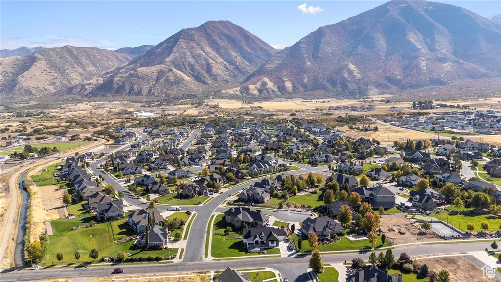 Birds eye view of property with a mountain view