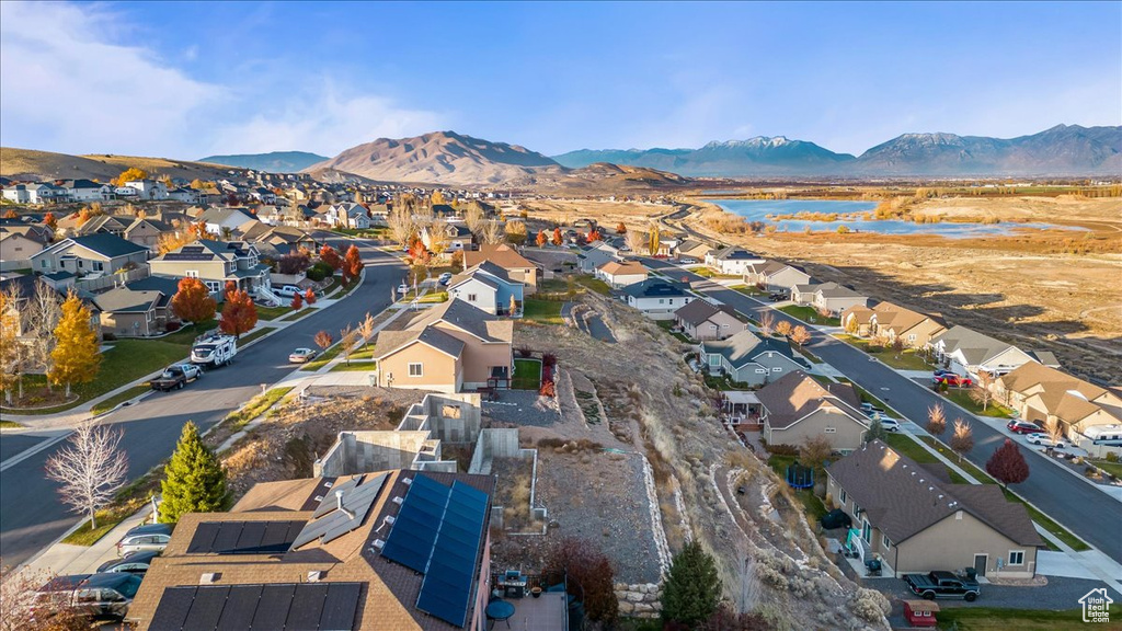 Birds eye view of property with a mountain view