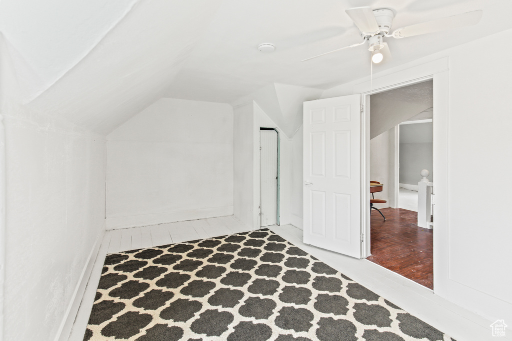 Bonus room with ceiling fan, vaulted ceiling, and hardwood / wood-style floors