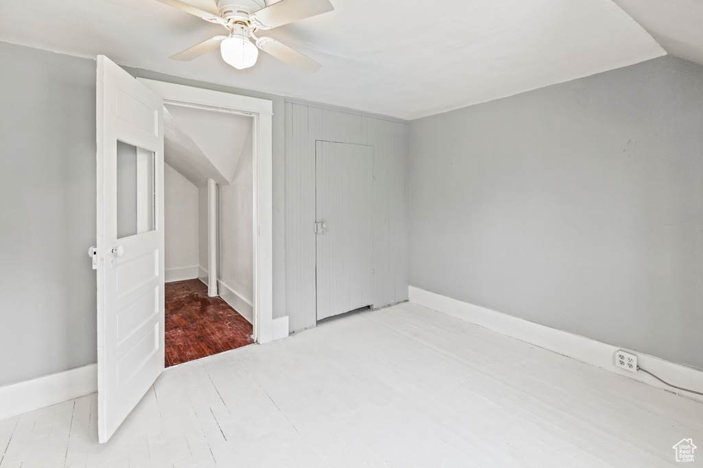 Unfurnished room featuring ceiling fan and light wood-type flooring