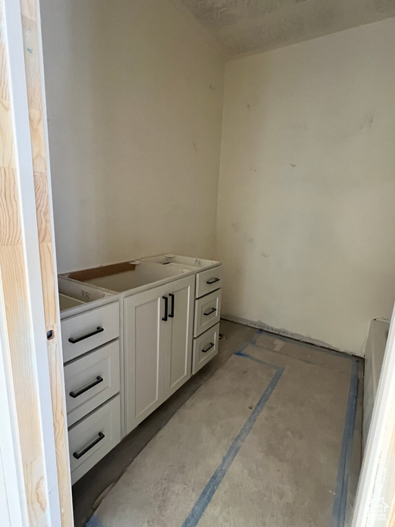 Bathroom featuring concrete flooring