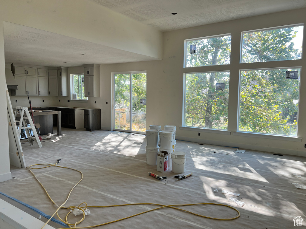 Unfurnished living room with plenty of natural light