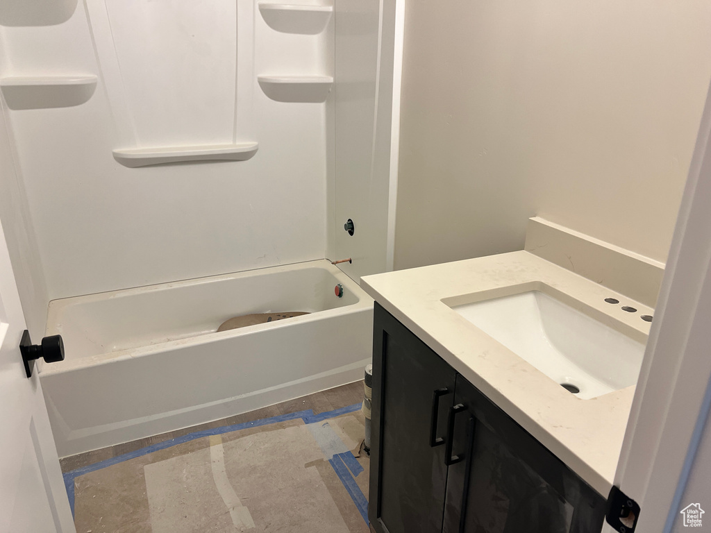 Bathroom with vanity and tub / shower combination