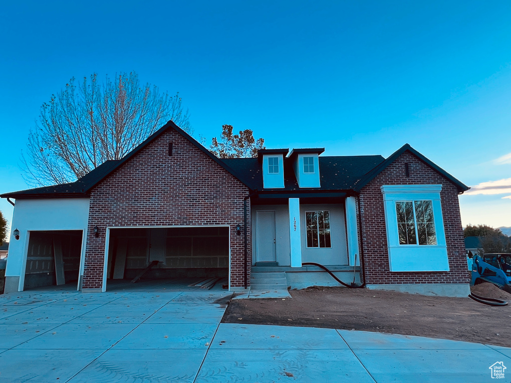 View of front of property with a garage