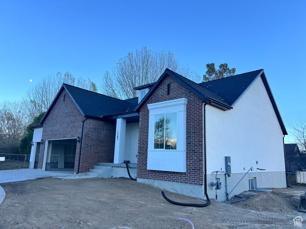 View of front facade with a garage