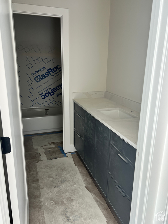 Bathroom with concrete flooring and vanity