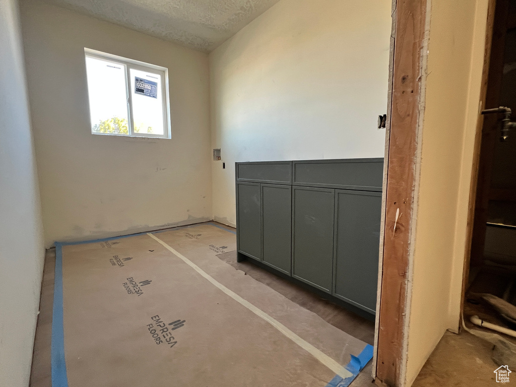 Spare room with a textured ceiling