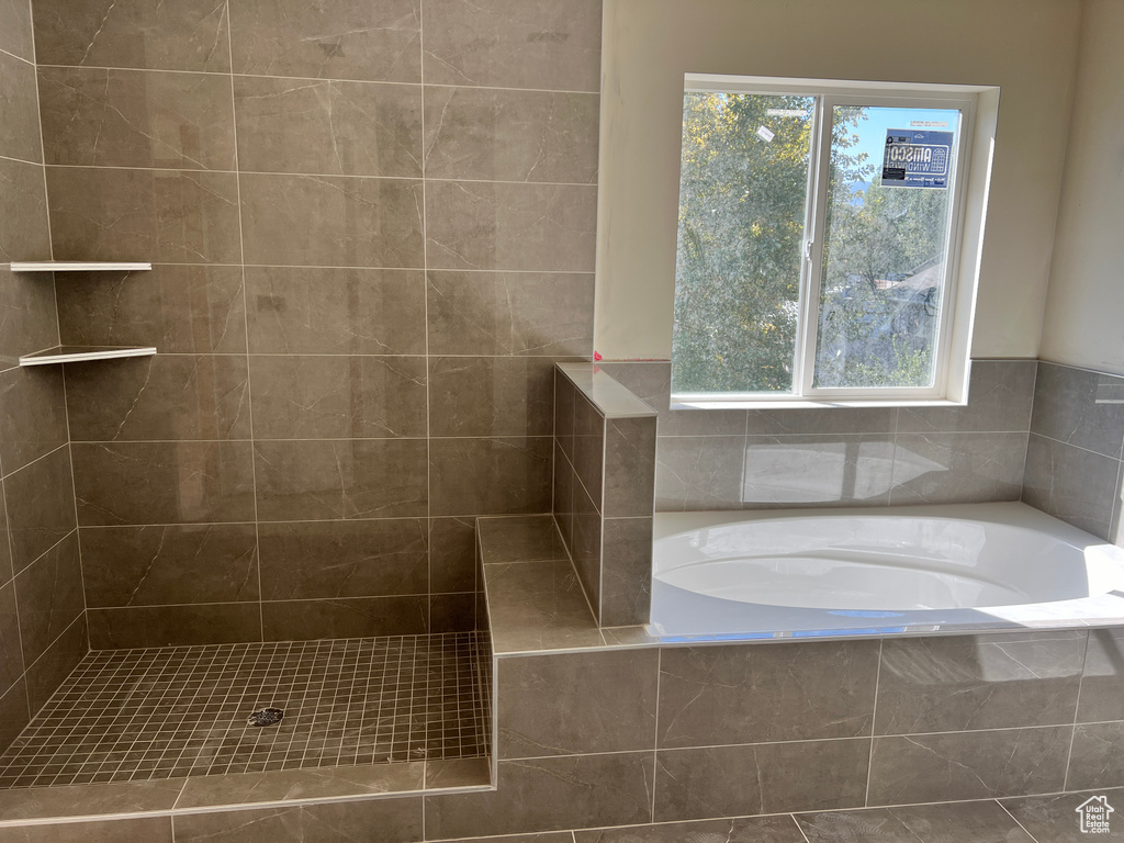 Bathroom featuring separate shower and tub