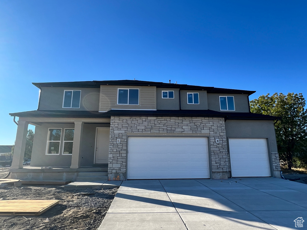 Prairie-style house featuring a garage