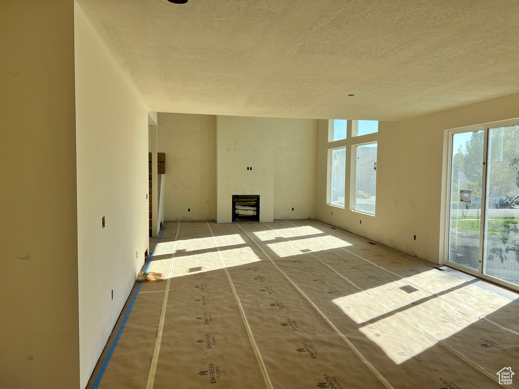 Unfurnished living room with a fireplace