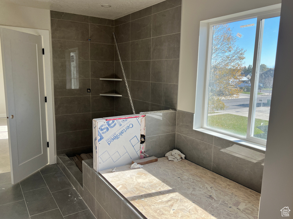 Bathroom with tile patterned floors